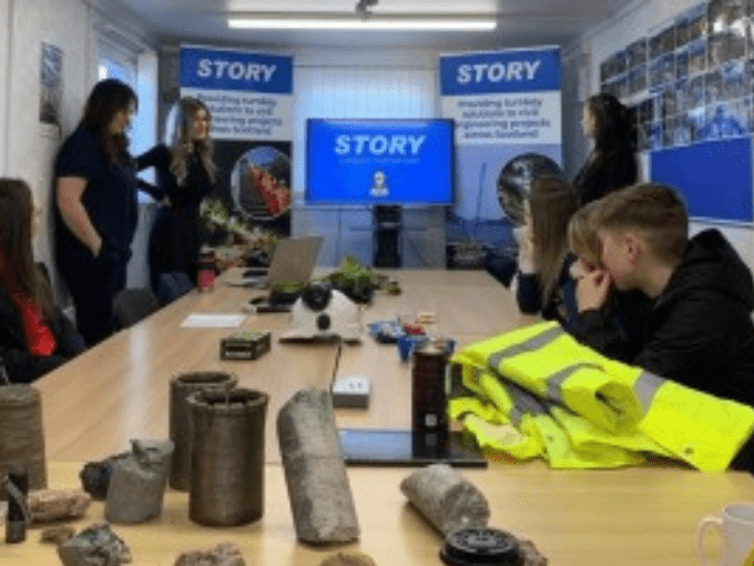 Image of young people listening to professionals at work tasters session with Story Contracting, on International Women's Day